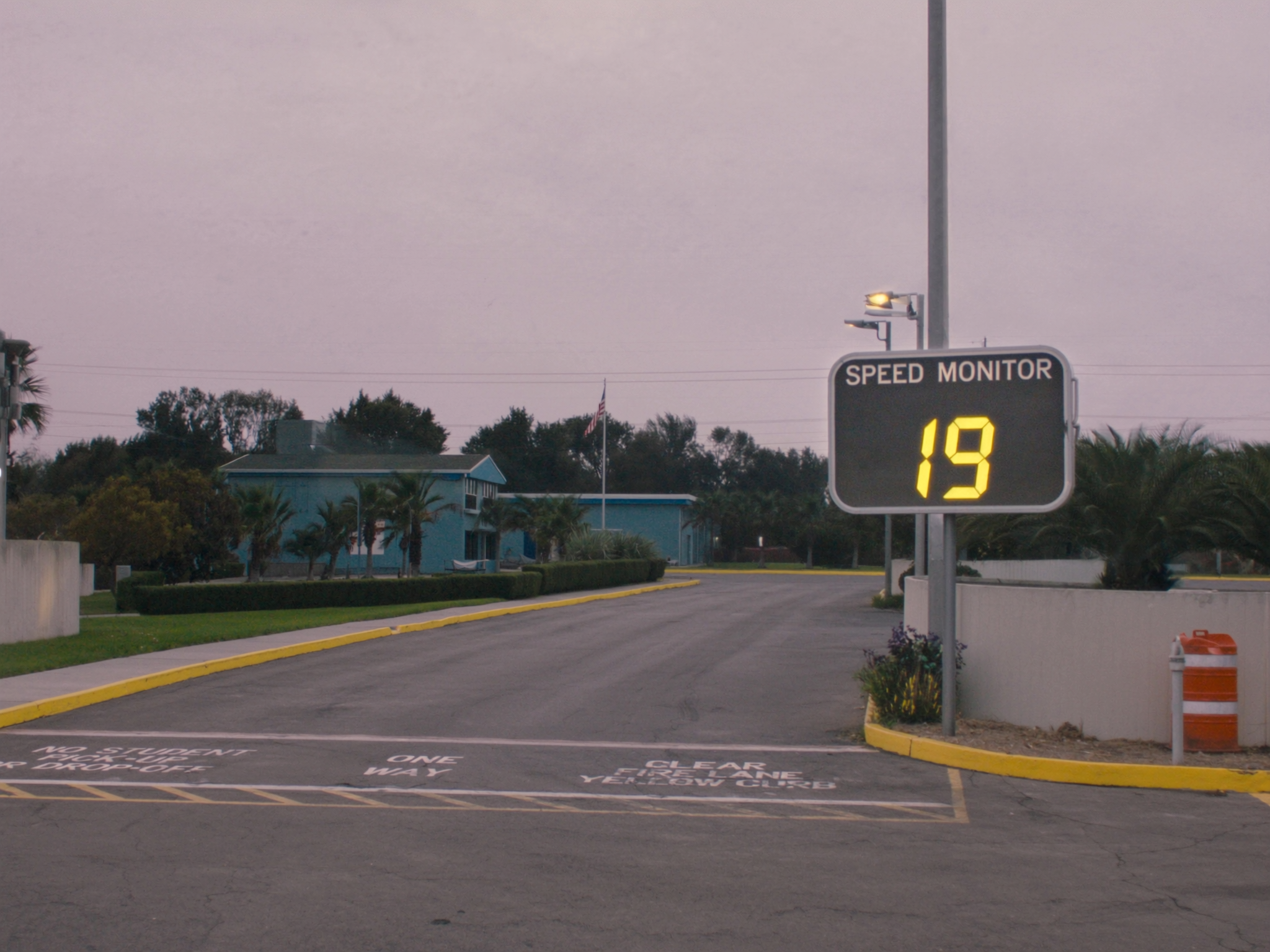 A school pickup lane at dusk